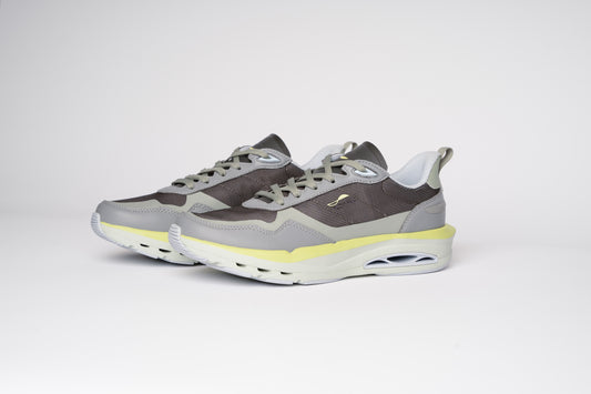 Gray and yellow sneakers on a white background