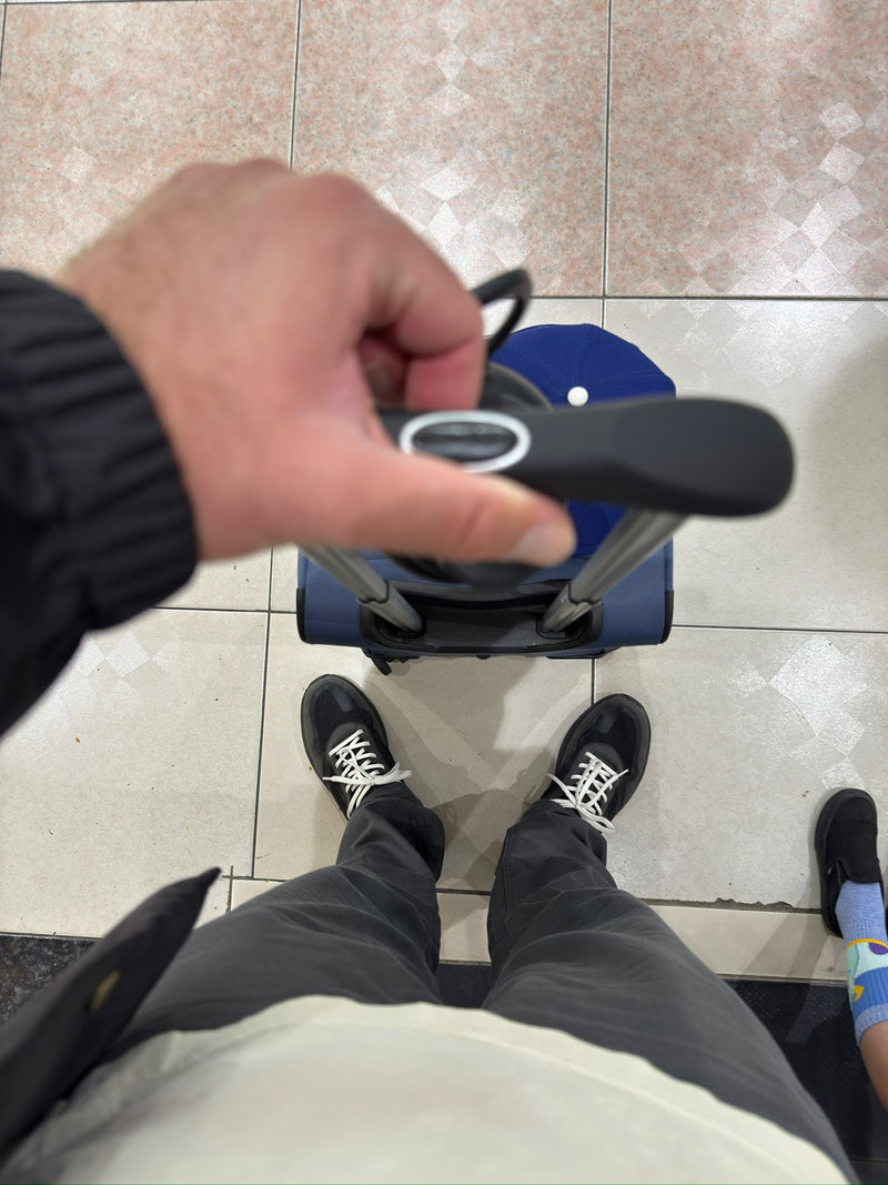 Best sneakers for airports and travel days – CDNCE travel shoes on jetway stairs

